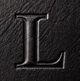 Embossed letter on black board