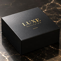 Black rigid gift box with gold Luxe logo